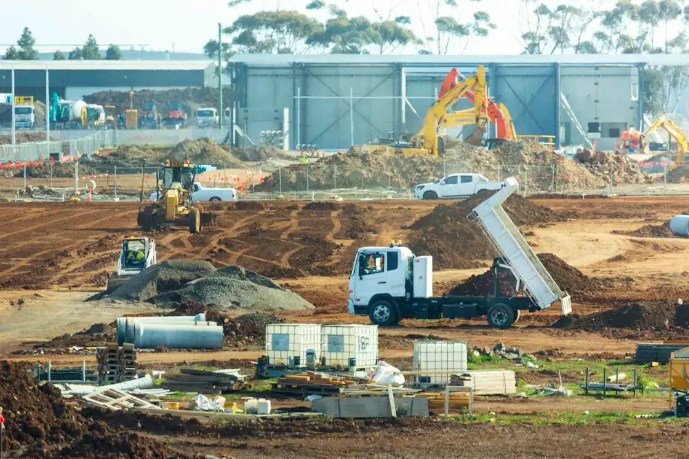 Commercial site work with excavators and a dump truck in Connecticut